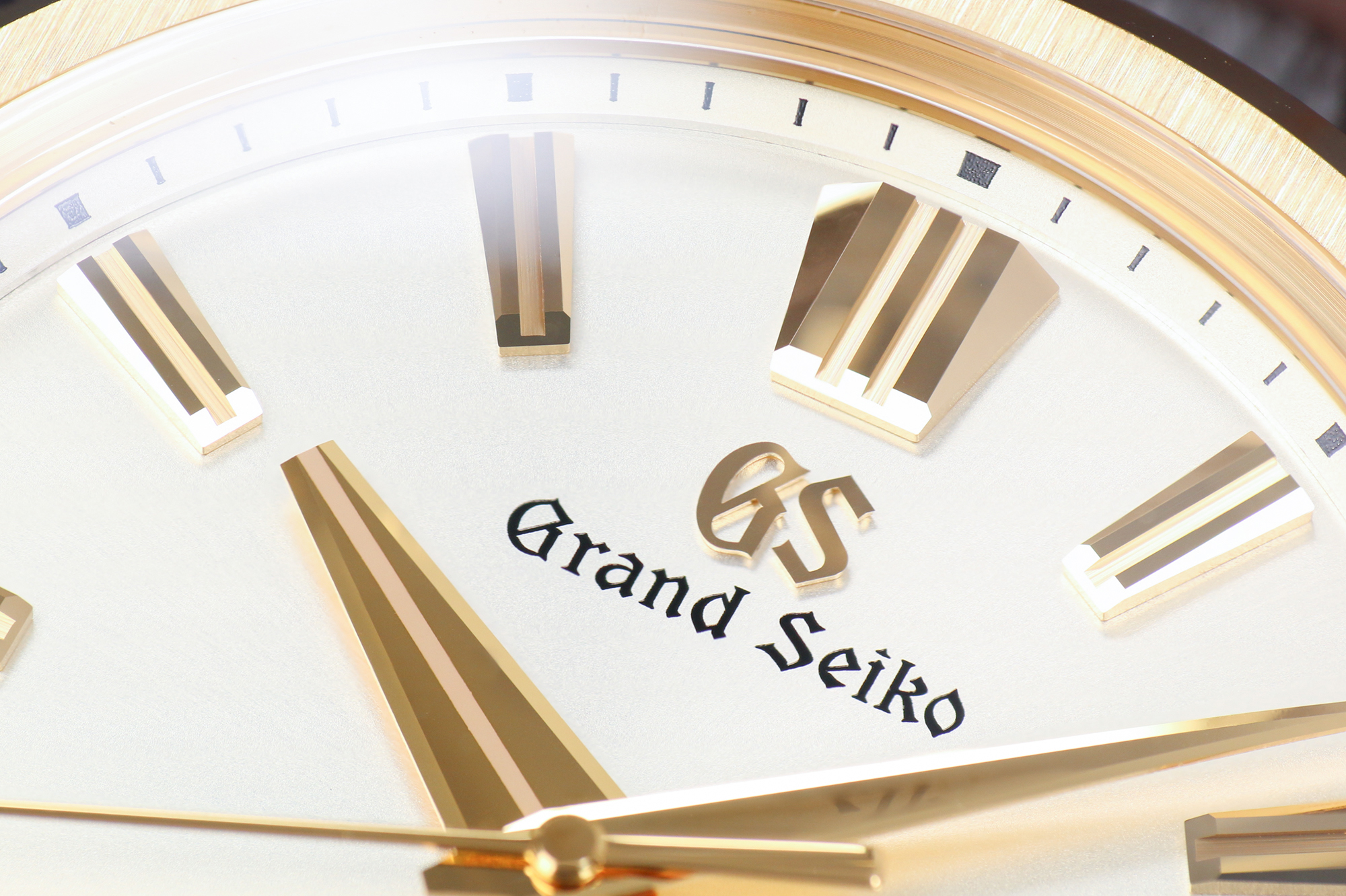 Grand Seiko SLGH002 with a gold case and light dial macro detail.