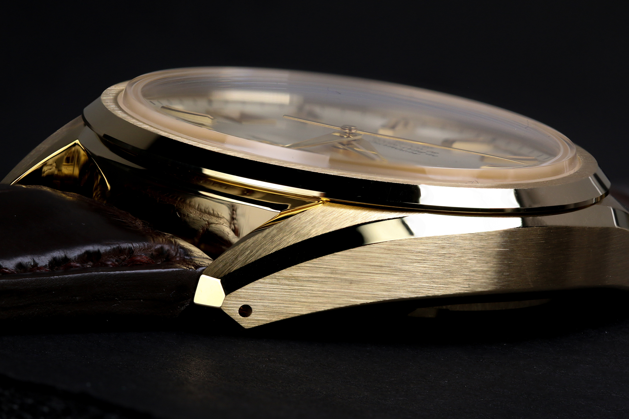 Grand Seiko SLGH002 gold case in profile.