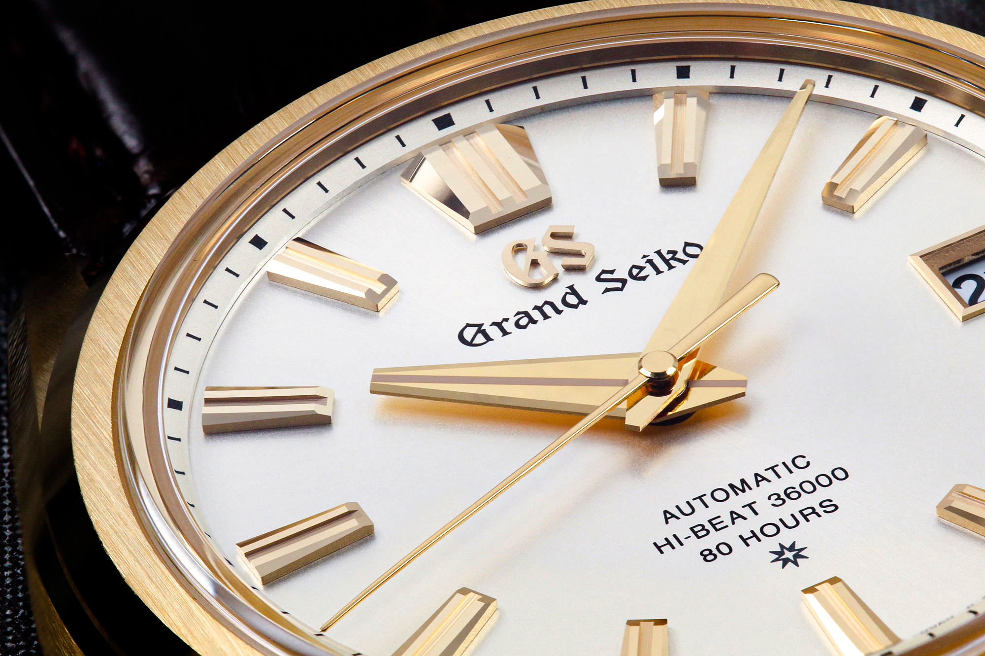 Grand Seiko SLGH002 with a gold case and light dial macro detail.